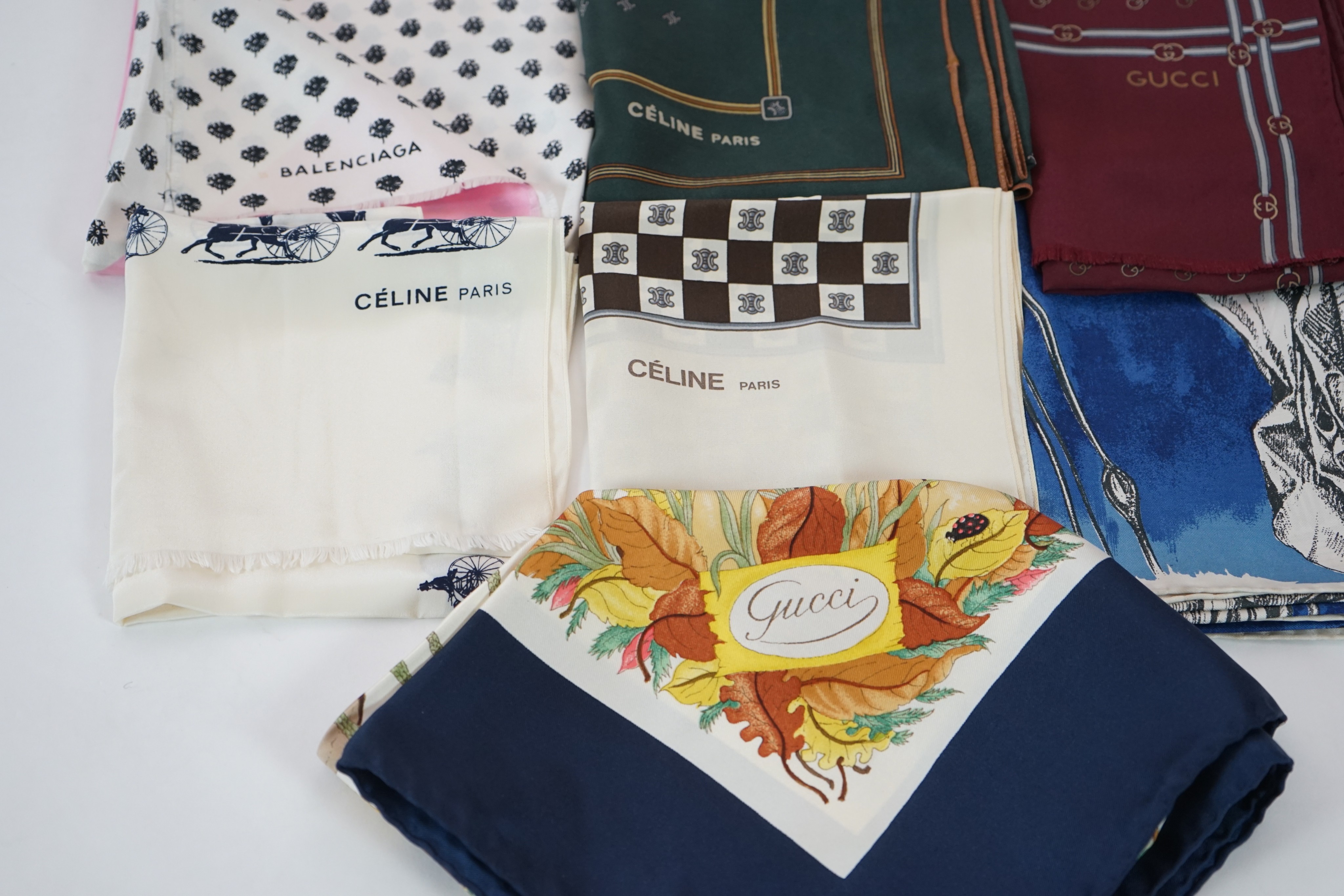 Three Gucci silk scarves, two by Celine and one by Balenciaga